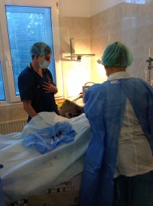 Dr. F is asking me about my systems, pain in my chest, horrible taste in my mouth and difficuclty  breathing